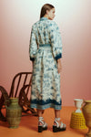 white shirtdress with blue delicate print and balloon sleeves with elasticated cuffs rear view 