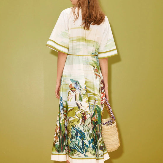 Rear view of woman wearing jungle print cotton dress from Alemais