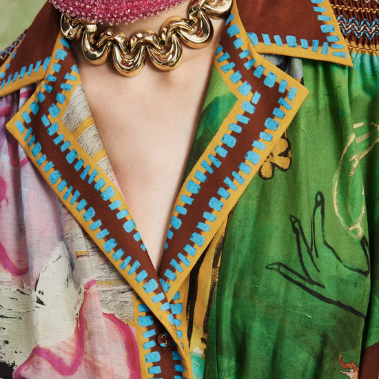 Woman wearing patterned Alemais dress close up