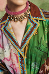 Woman wearing patterned Alemais dress close up
