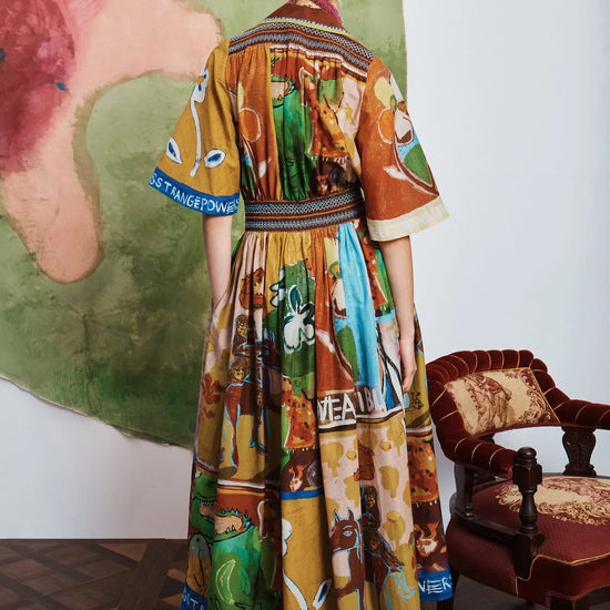 Woman wearing patterned Alemais dress rear view