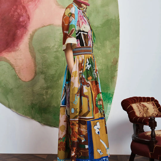 Woman wearing patterned Alemais dress side view