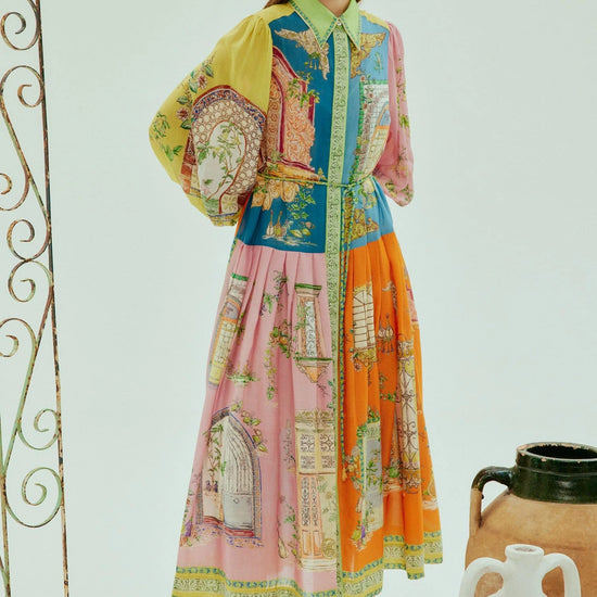 mid length colourful shirtdress with balloon sleeves and self tie belt with a point collar and concealed placket  model shot