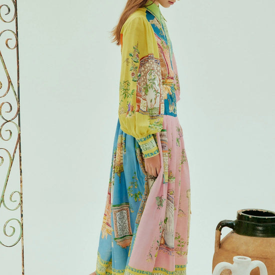 mid length colourful shirtdress with balloon sleeves and self tie belt with a point collar and concealed placket  side view 