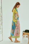 mid length colourful shirtdress with balloon sleeves and self tie belt with a point collar and concealed placket  side view 