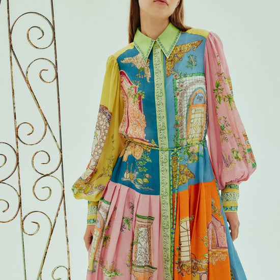 mid length colourful shirtdress with balloon sleeves and self tie belt with a point collar and concealed placket model shot