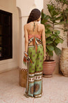 wide leg silk trousers with drawstring waistband and vibrant print from alemais rear view