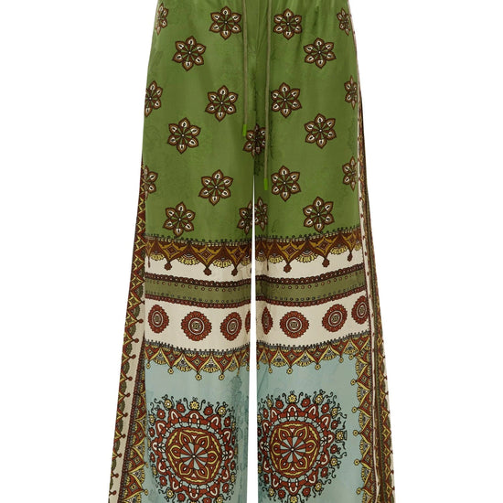 wide leg silk trousers with drawstring waistband and vibrant print from alemais