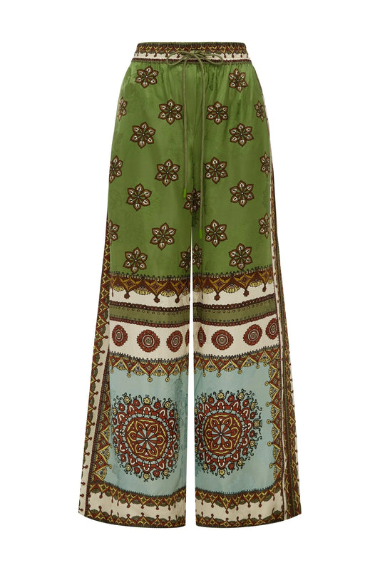 wide leg silk trousers with drawstring waistband and vibrant print from alemais