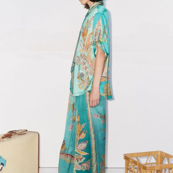 teal silk trousers with elasticated waist and floral print side view