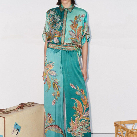 teal silk trousers with elasticated waist and floral print