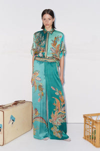 teal silk trousers with elasticated waist and floral print