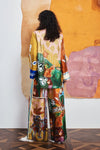 Colorful patchwork trousers with floral and abstract patterns by Alemais rear view