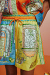 orange, blue and yellow patterned drawstring shorts close up