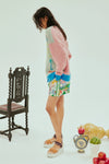 oversized cardigan with illustrations, 4 buttons and dropped shoulders  side view 