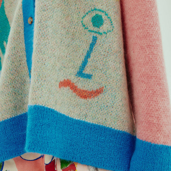 oversized cardigan with illustrations, 4 buttons and dropped shoulders  close up