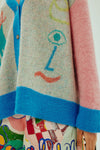 oversized cardigan with illustrations, 4 buttons and dropped shoulders  close up