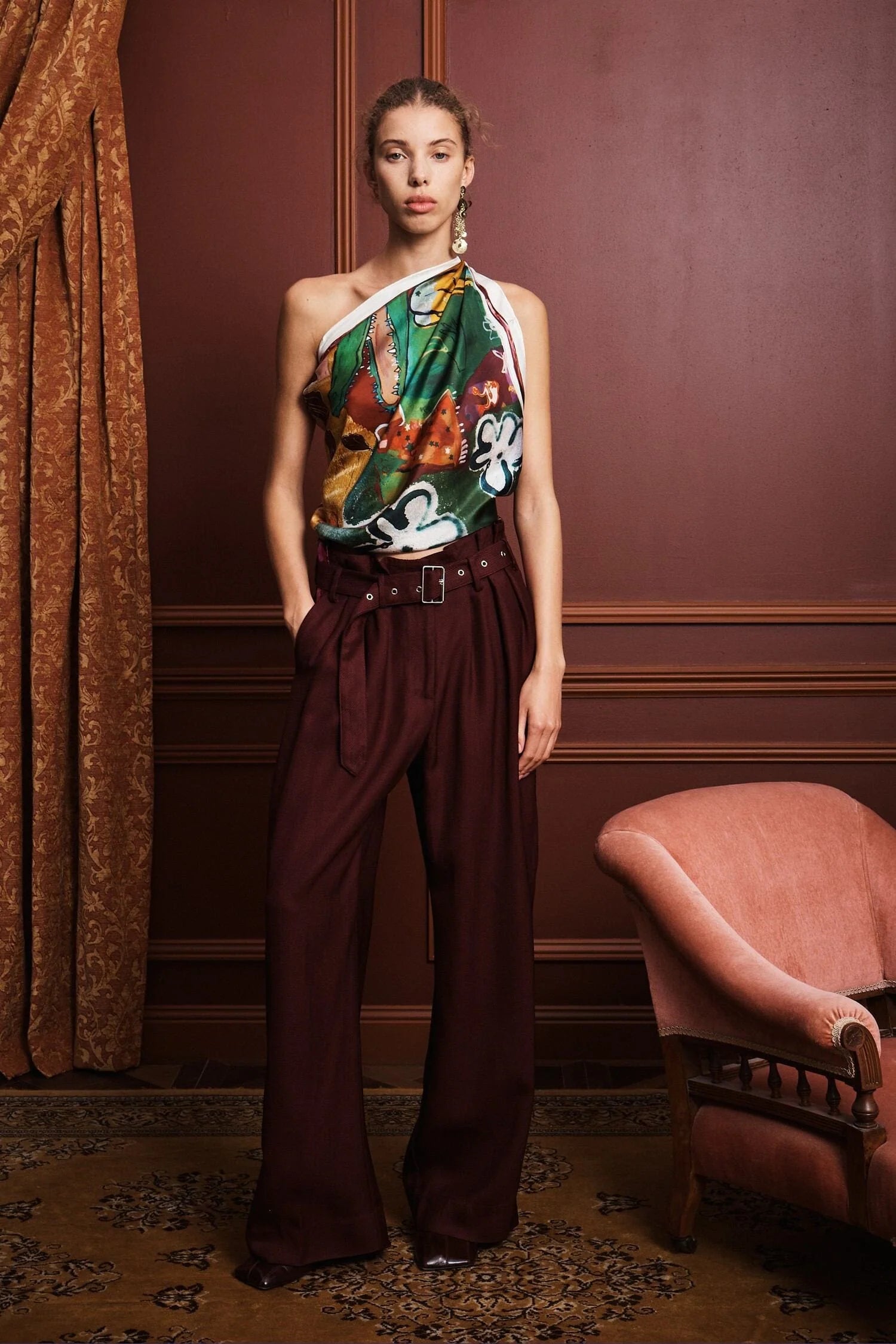 Colorful patchwork scarf with floral and abstract patterns by Alemais on a white background being worn as a top