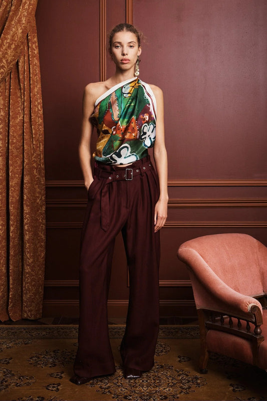 Colorful patchwork scarf with floral and abstract patterns by Alemais on a white background being worn as a top