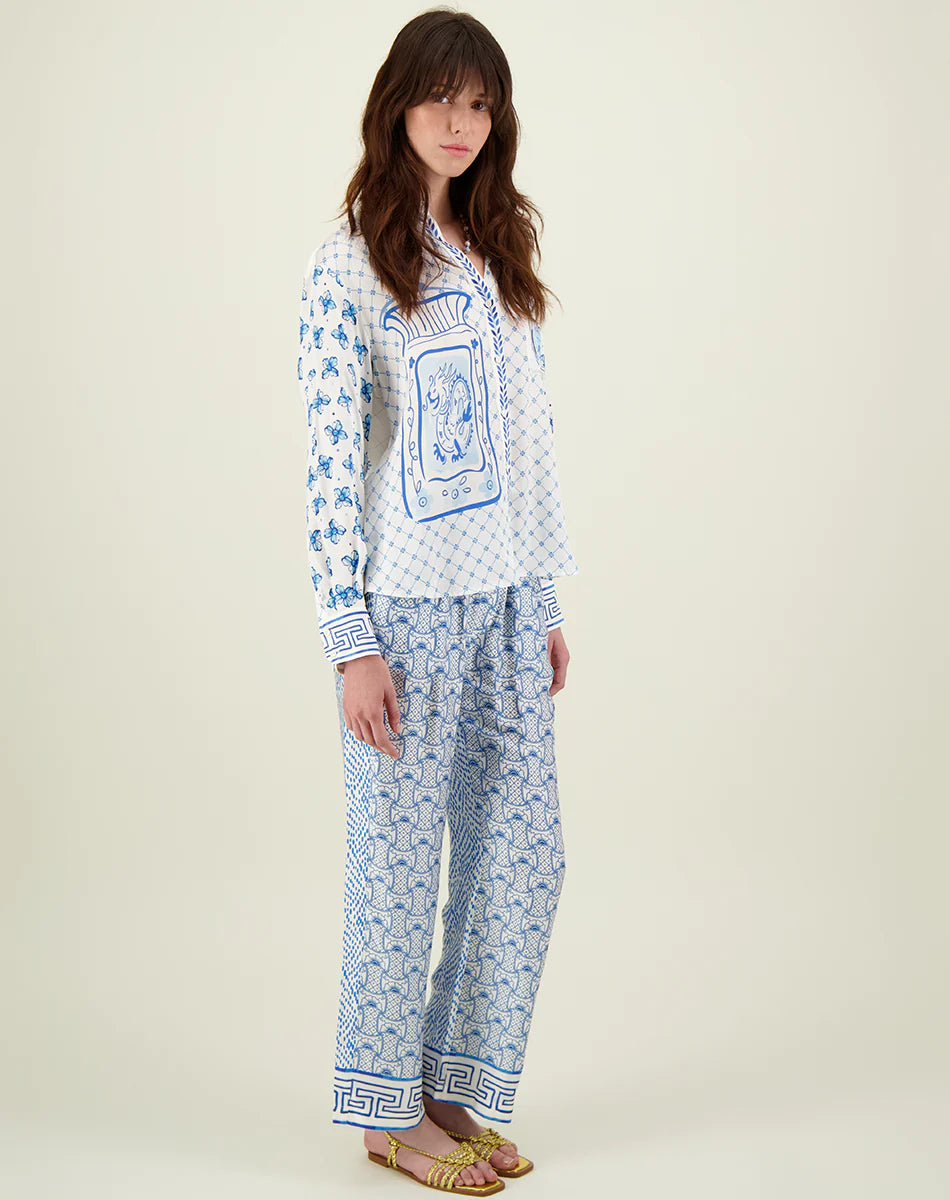 Blue and ivory patterned straight leg trousers with border hems and contrast fabric on the back