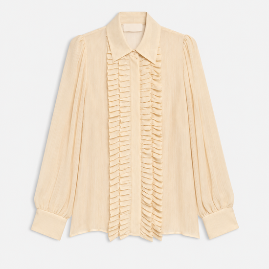 A pale cream or light beige long-sleeve blouse with a pointed collar, gathered sleeves, and a central vertical ruffle detail, shown on a plain light background.