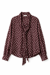 Brown polka dot blouse with a tie detail on a white background