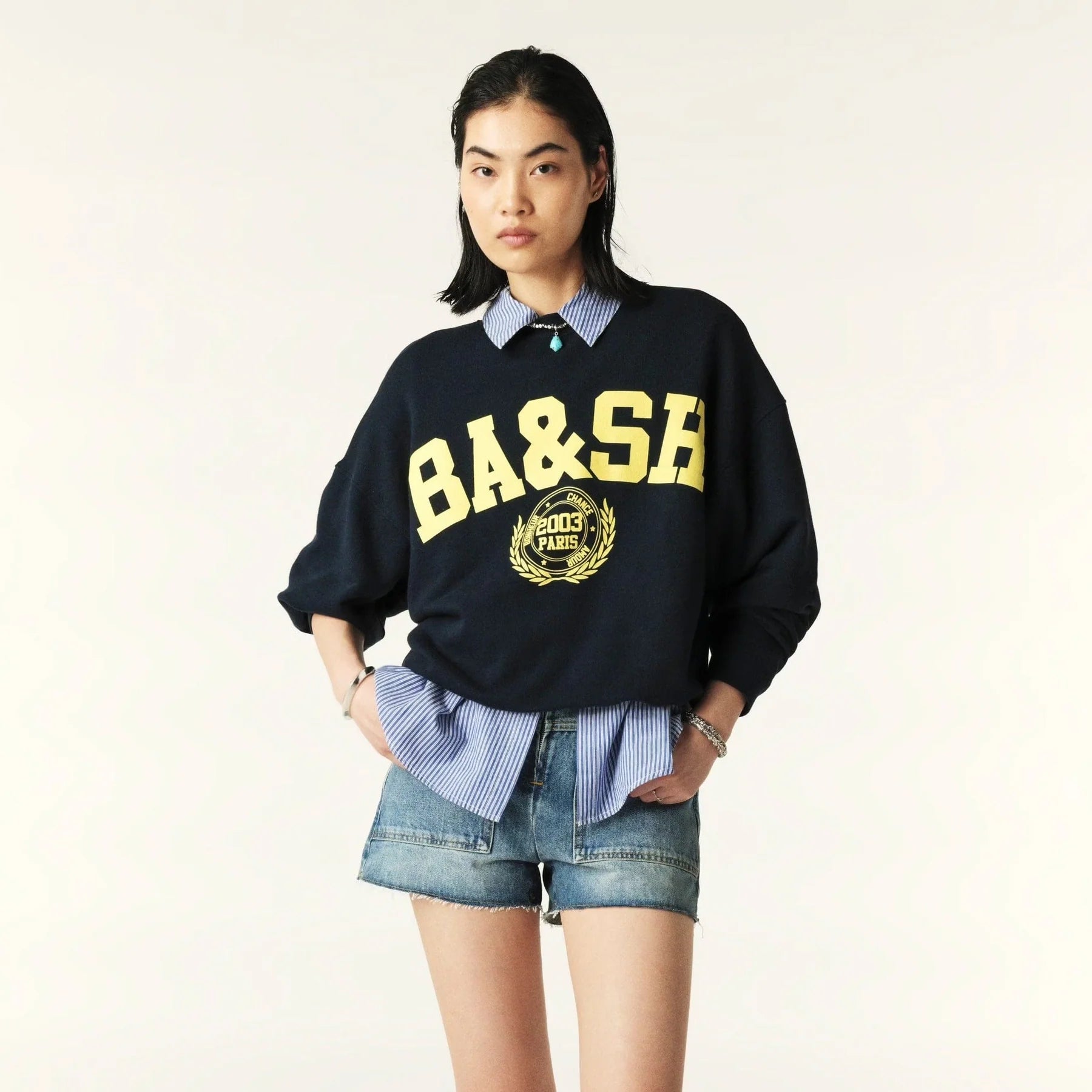 Model shot navy sweatshirt with yellow ba&sh branding