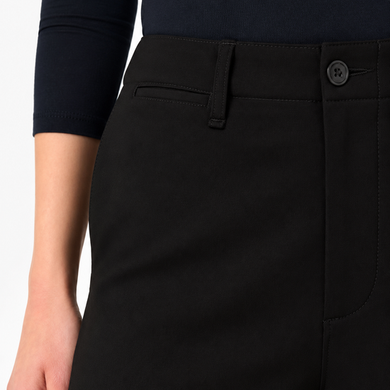 a close up image of the waistband of a black trouser
