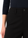 a close up image of the waistband of a black trouser