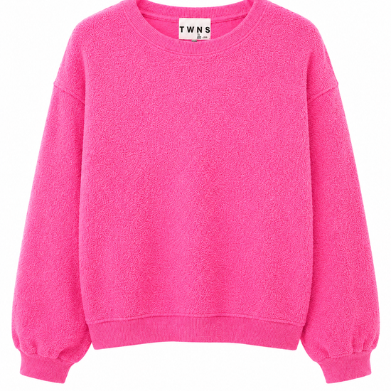 A bright pink crewneck sweatshirt with balloon sleeves, shown flat against a plain white background. The brand label inside the collar reads 'TWNS'.