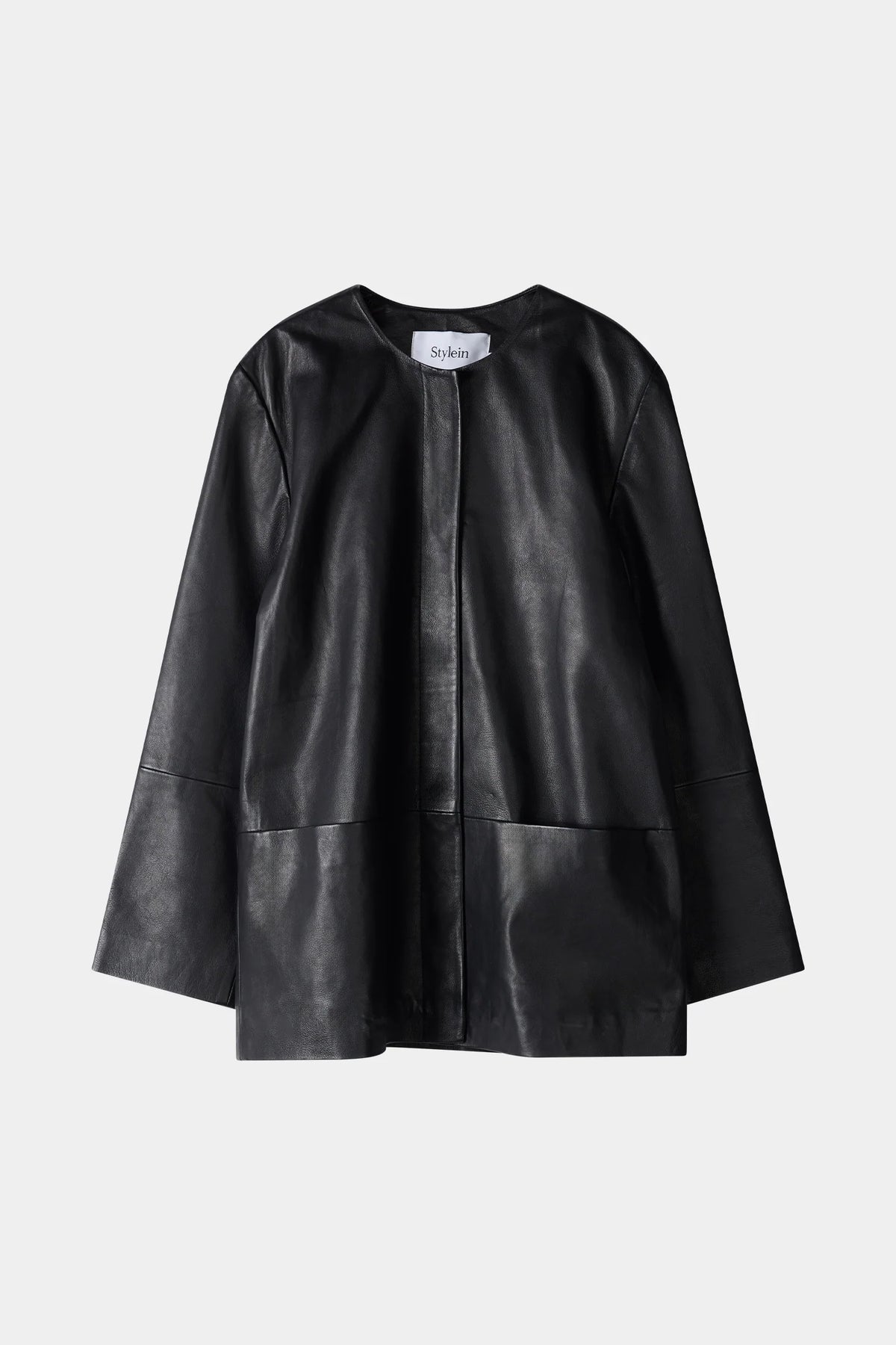 Black leather cape on a light gray background