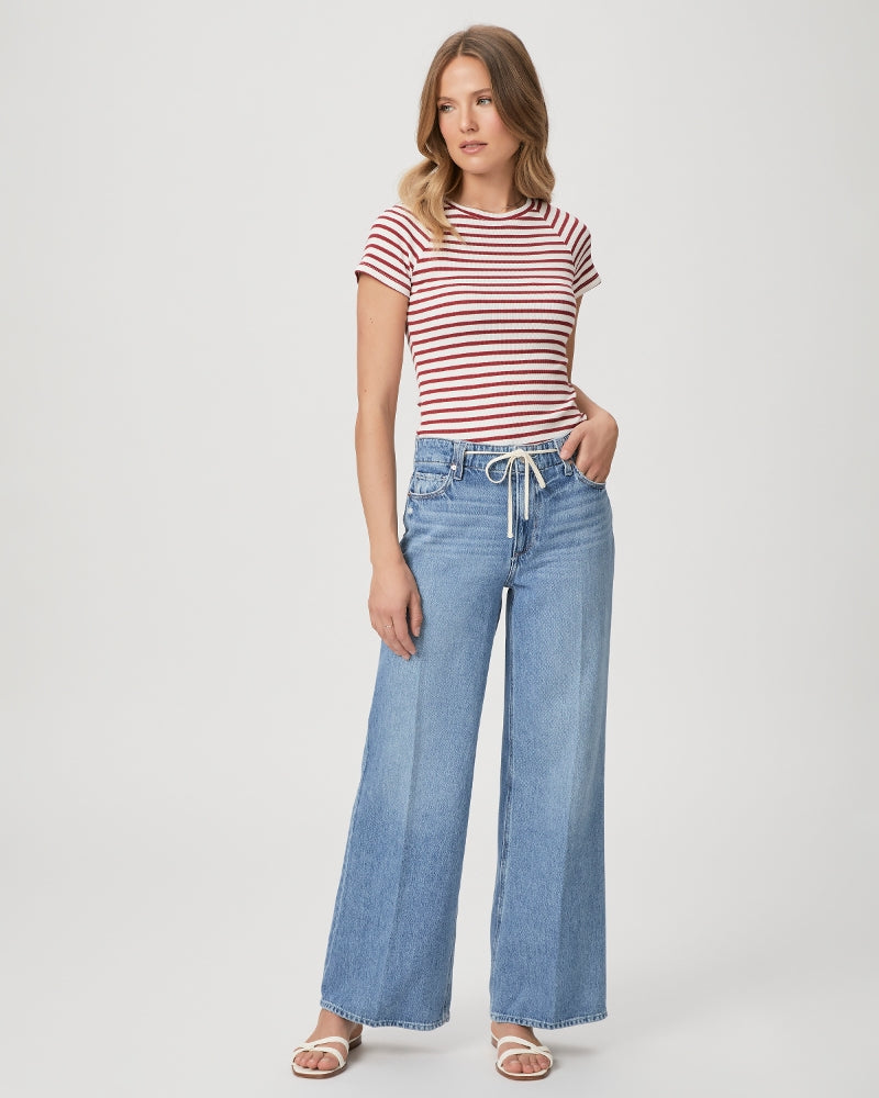 Mid to light wash blue denim wide leg jeans with drawstring cord