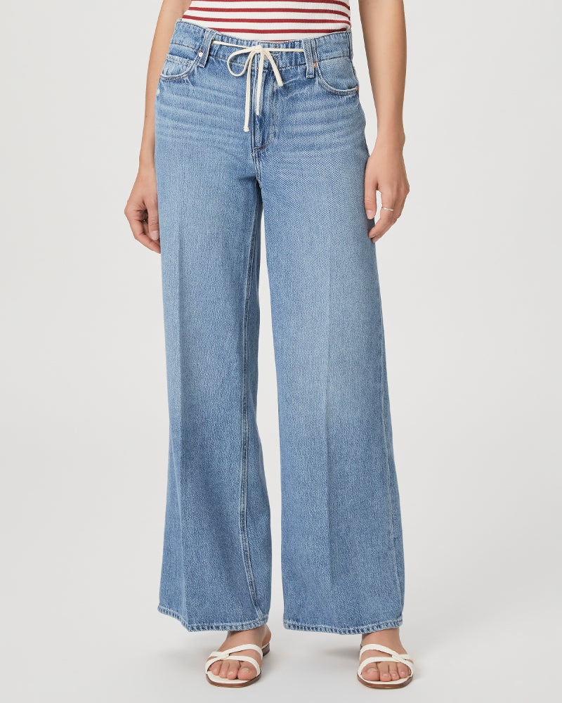Mid to light wash blue denim wide leg jeans with drawstring cord 