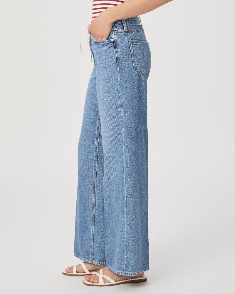 Mid to light wash blue denim wide leg jeans with drawstring cord