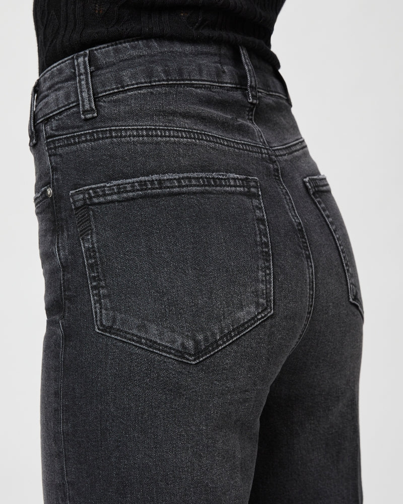 Straight wide leg black denim jeans with silver hardware and slight distressing