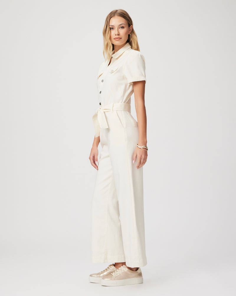 Cream short sleeved jumpsuit with straight leg, tie waist and silver button fastening