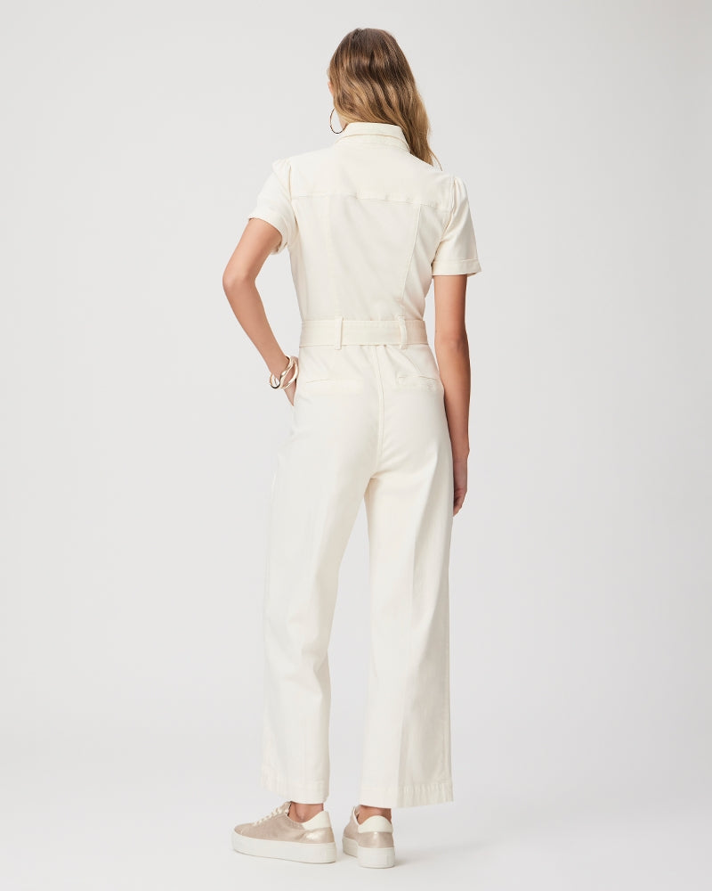 Cream short sleeved jumpsuit with straight leg, tie waist and silver button fastening