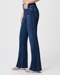 Straight cut blue denim jeans with 32 " leg and raw hem