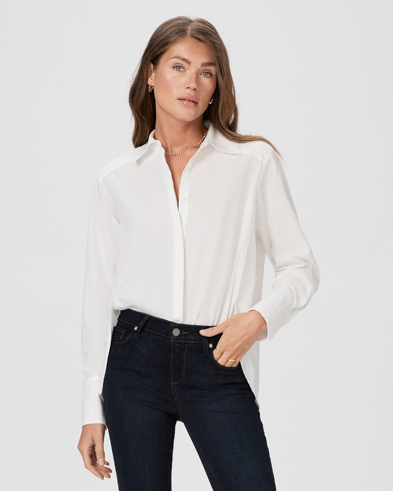 White shirt with full length covered placket and classic collar with side vents and curved dropped hem