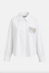 White shirt with gold embroidery on a white background