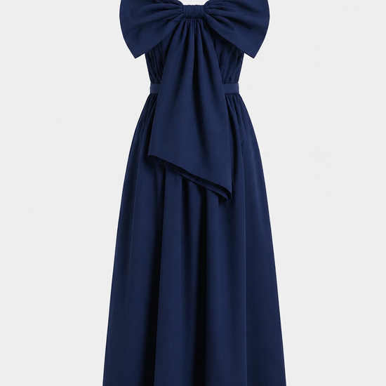 Navy blue dress with a large bow detail on a light gray background