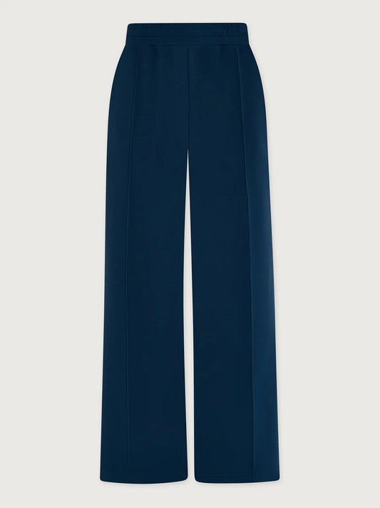 A pair of high-waisted, wide-leg trousers in a deep navy blue, shown flat against a light gray background.