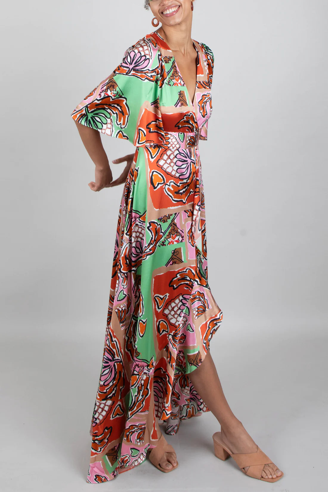 Green brown pink and black silk faux wrap dress with elbow length sleeves and a cascading shaped maxi hemline