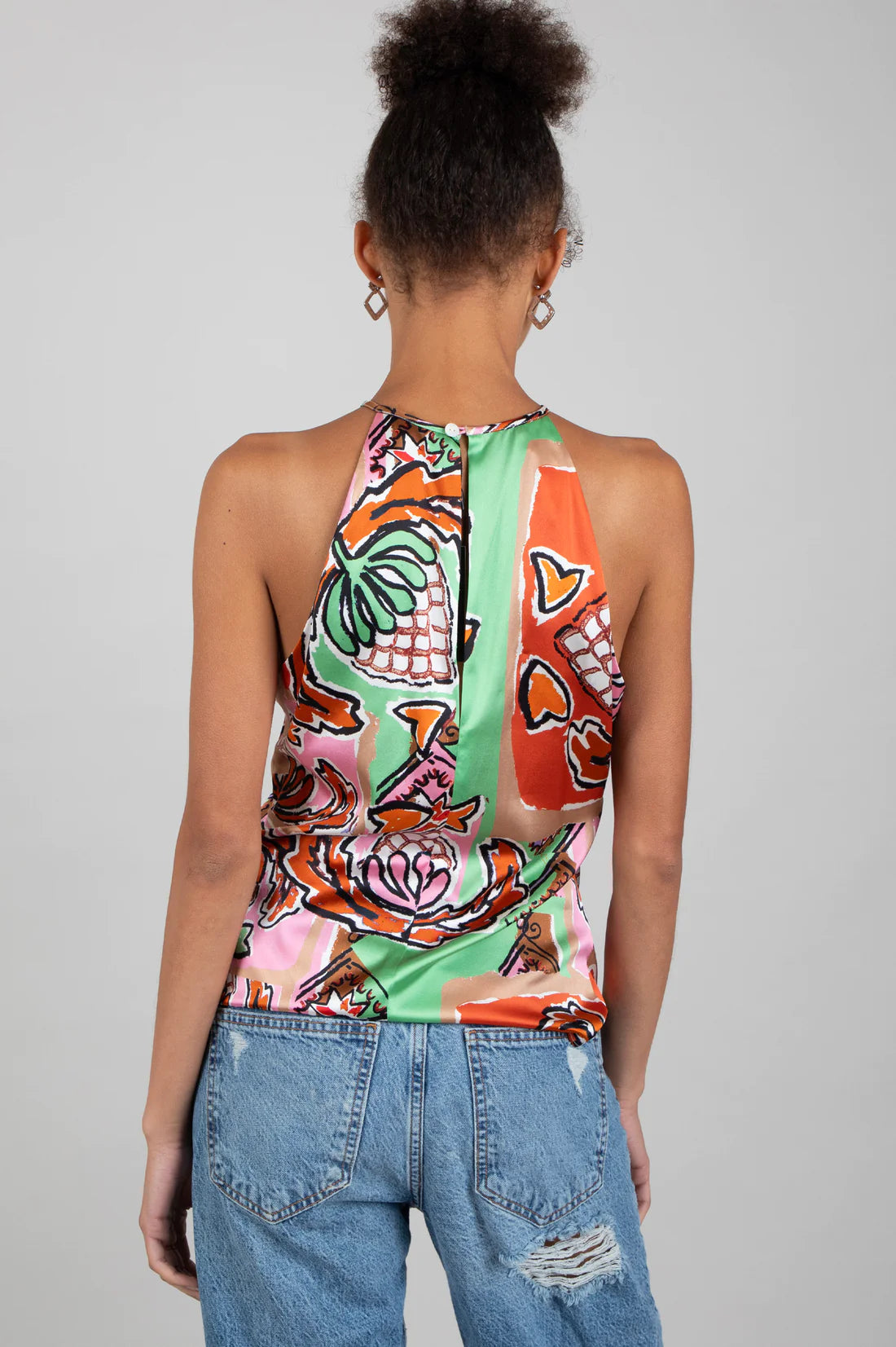 Halterneck silk top with abstract fruit print in oranges, green and pink