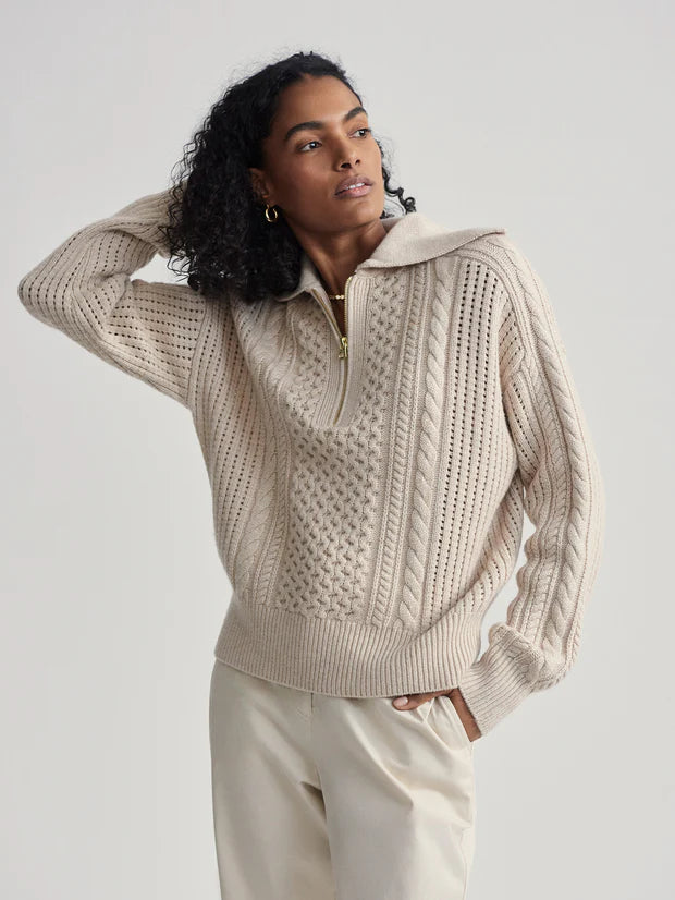 beige cable knit sweater with oversized collar and quarter zip model shot