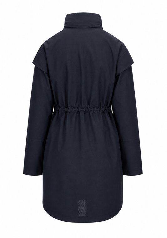 A dark navy blue coat shown from the back, featuring a high collar, wide shoulder panels, a drawstring waist, and a small rectangular patch near the bottom hem, set against a plain white background.
