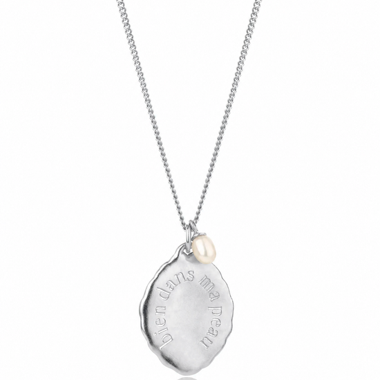 Silver necklace with a pendant on a white background