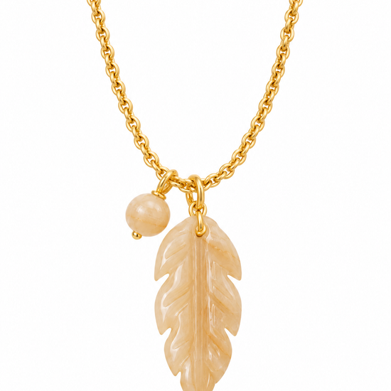 gold chain necklace with a smokey quarts stone leaf pendant on the necklace