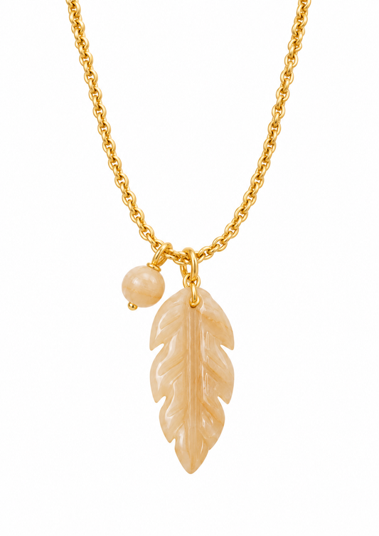 gold chain necklace with a smokey quarts stone leaf pendant on the necklace