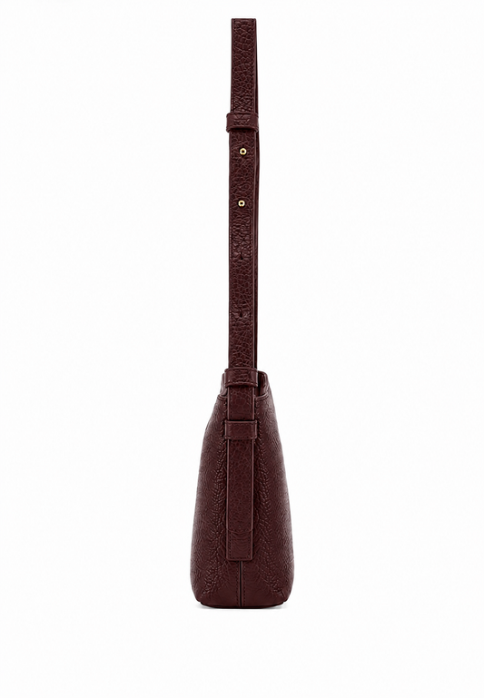 A dark brown textured leather shoulder bag shown from the back, featuring a matching leather strap with gold-tone rivets and a small embossed logo, set against a plain white background.
